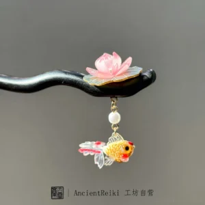 Ancient Chinese koi hair stick featuring a pink lotus blossom, white pearl pendant, golden fish charm, and elegant curved black wooden design