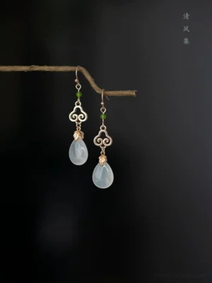 Antique cloud and dewdrop Chinese earrings with gold tone cloud charms translucent milky drops and green beads for Hanfu and Qipao