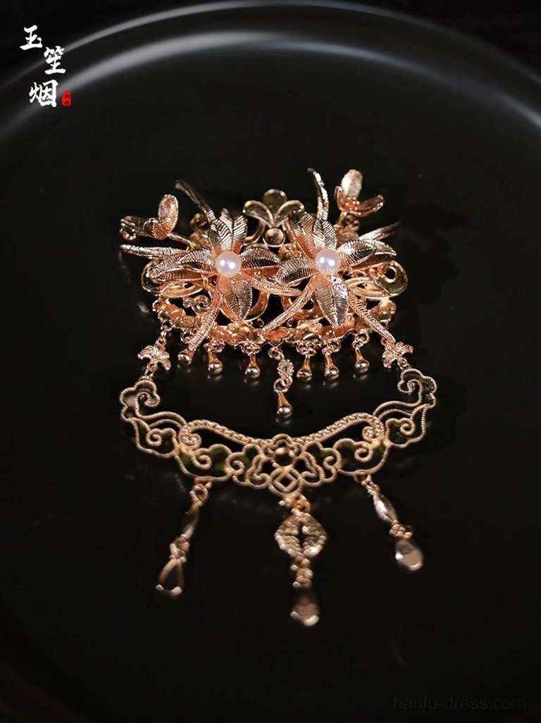Antique gold Chinese forehead hair crown with carved floral motifs, pearl accents, cloud-inspired dangling pendants, and traditional Hanfu styling