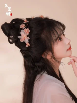 Side profile of traditional Chinese apricot blossom Hanfu hair accessories arranged on a graceful side bun hairstyle