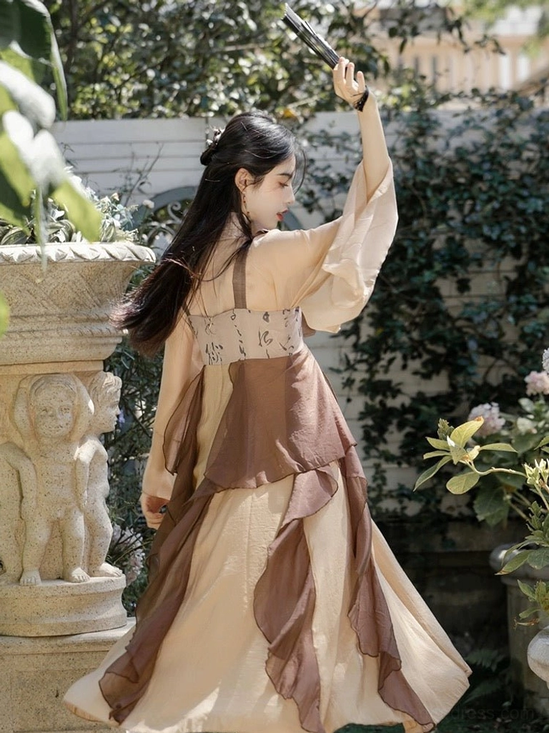 Back three-quarter view of modern Tang style Hanfu dress set showing sheer long sleeves and layered apricot brown chiffon-style skirt