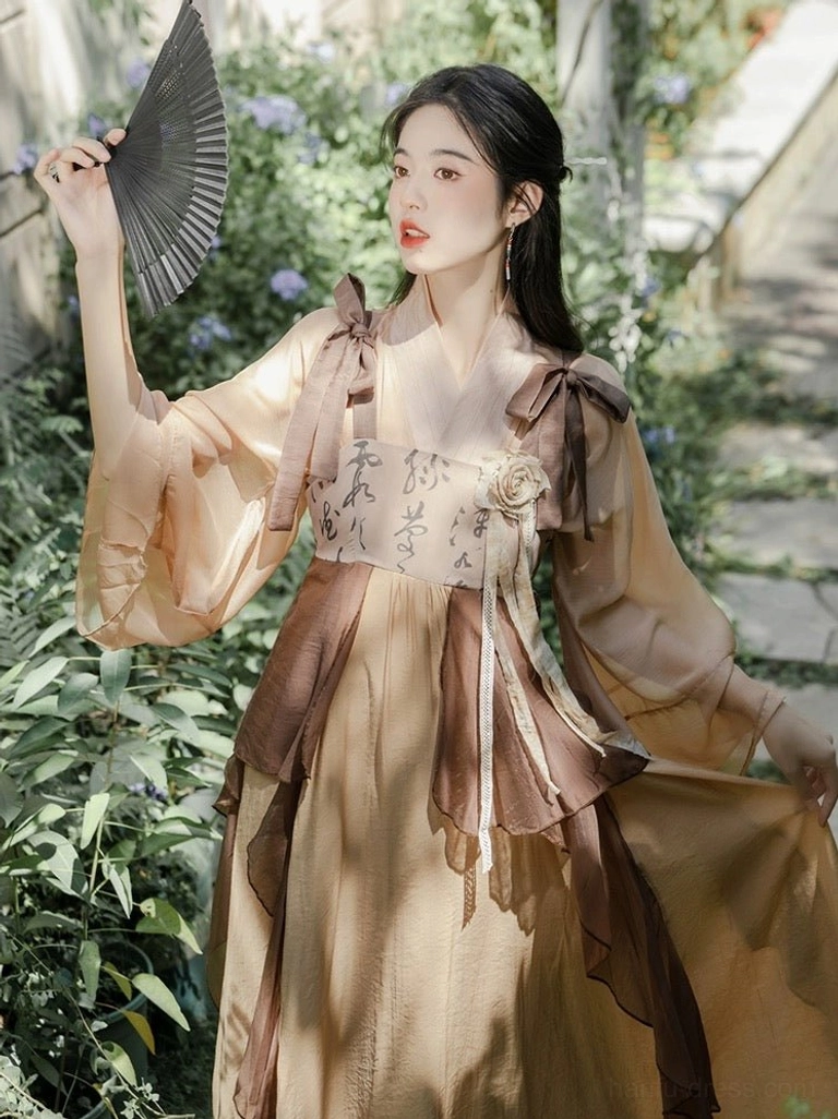 Side view of apricot brown modern Tang style Hanfu dress with oversized sheer flared sleeves, calligraphy bodice and ruffled waist