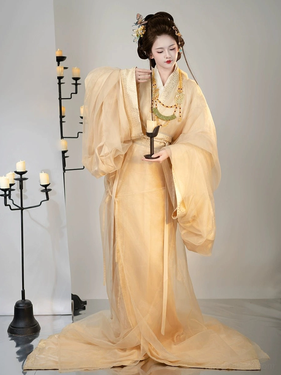 Apricot Han Dynasty Hanfu straight-hem robe front portrait with puffed wide sleeves, waist sash, jade-style necklace, and traditional hair ornaments