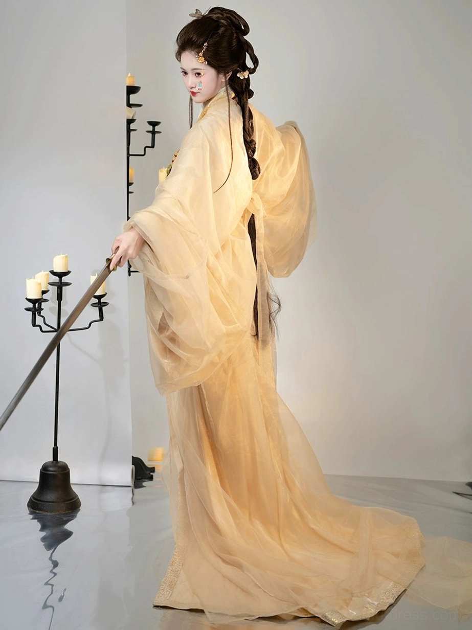 Side view of apricot Han Dynasty Hanfu straight-hem robe complete set featuring wide flowing sleeves and dramatic floor-length trailing hem
