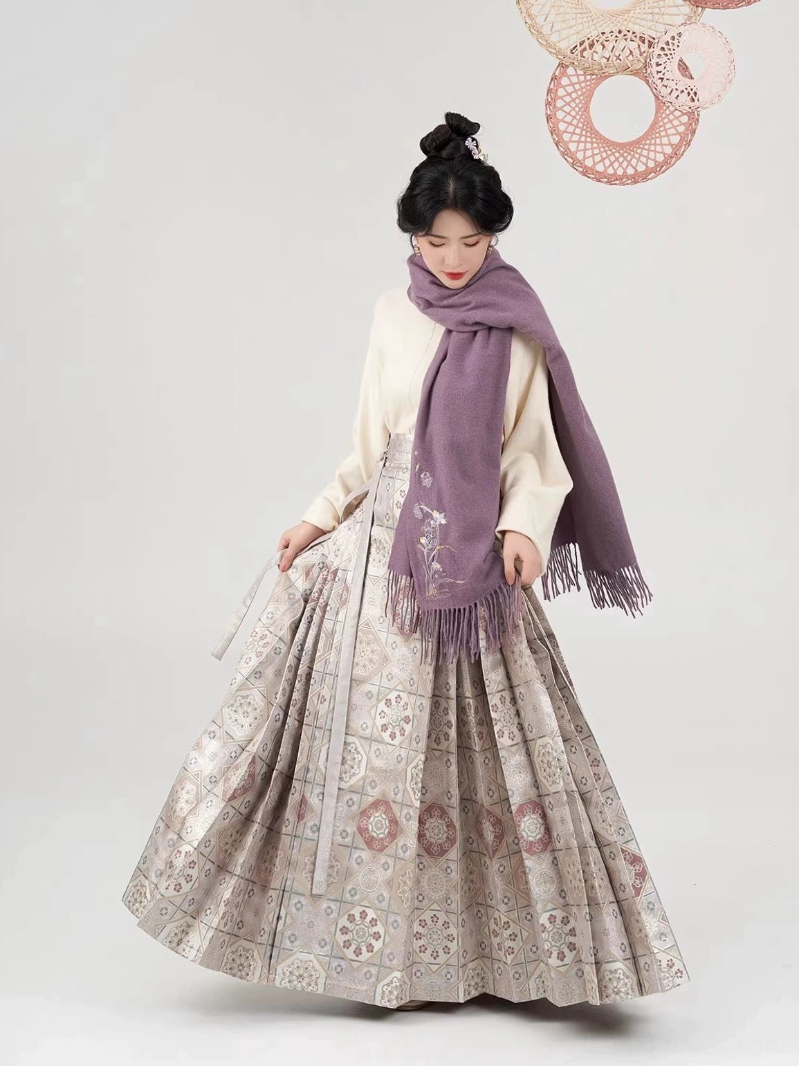 Apricot knit Hanfu top with embroidered mauve tassel scarf and geometric brocade mamian skirt side view