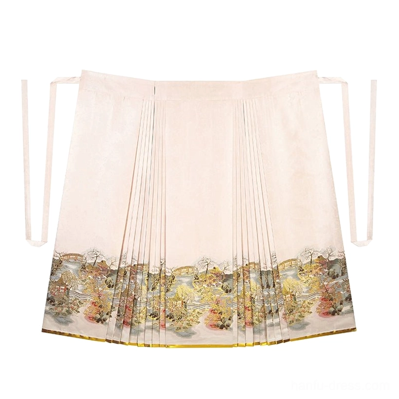Flat lay of a traditional inspired apricot mamian horse-face skirt with pleated panels, side tying straps, scenic landscape print hem, and gold edging