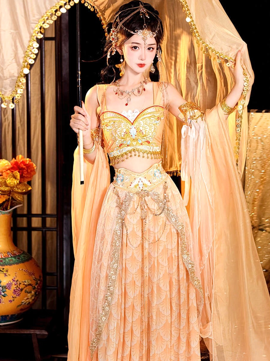 Close-up of an apricot peach Dunhuang Feitian costume camisole with ornate gold detailing and vintage-inspired Tang Dynasty styling