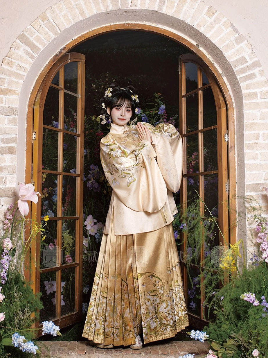 Apricot satin Hanfu outfit featuring a short pipa sleeve standing collar top and golden floral embroidered mamianqun skirt