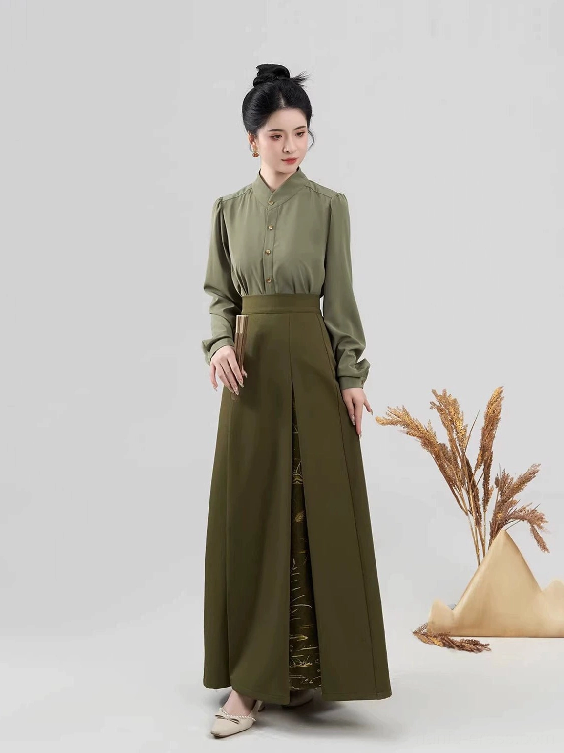 Front view of an army green modern Hanfu blouse and matching wide-leg pleated skirt with a high waist and side slit