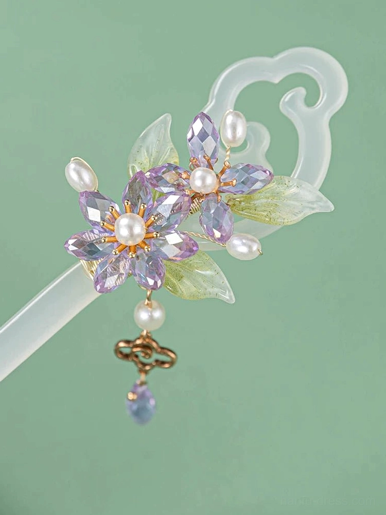 Aurora Night Chinese hair accessory shown from the side with dual purple crystal flower clusters, faux pearls, green resin leaves, and a dangling cloud charm