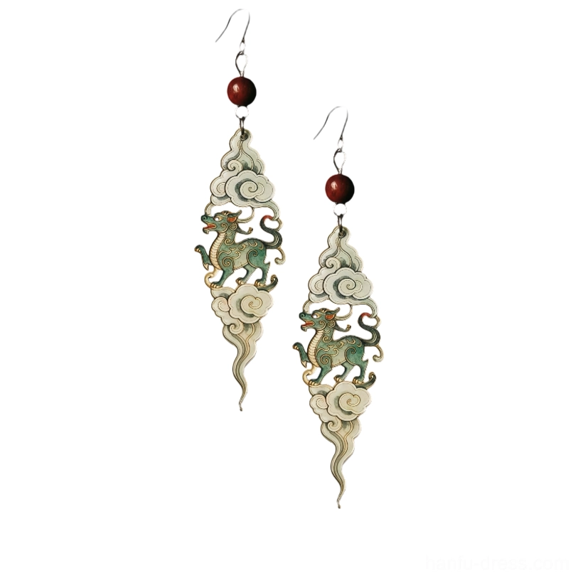 Flat lay display of complete auspicious cloud Qilin drop earrings showing silver hooks cloud shaped frames green pendants and red beads