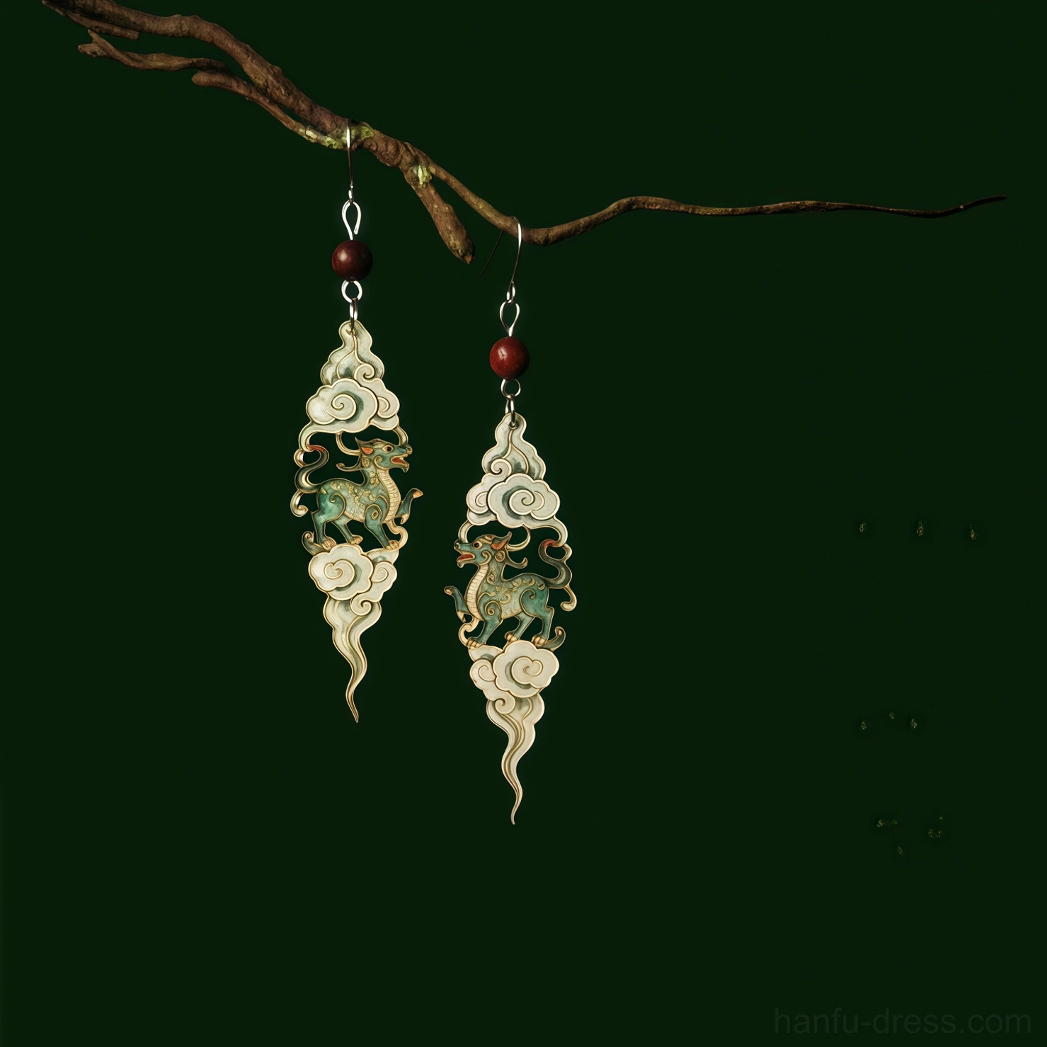 Auspicious cloud Qilin drop Hanfu earrings with off white cloud frames green patina mythical creature pendants and dark red accent beads on a dark green background