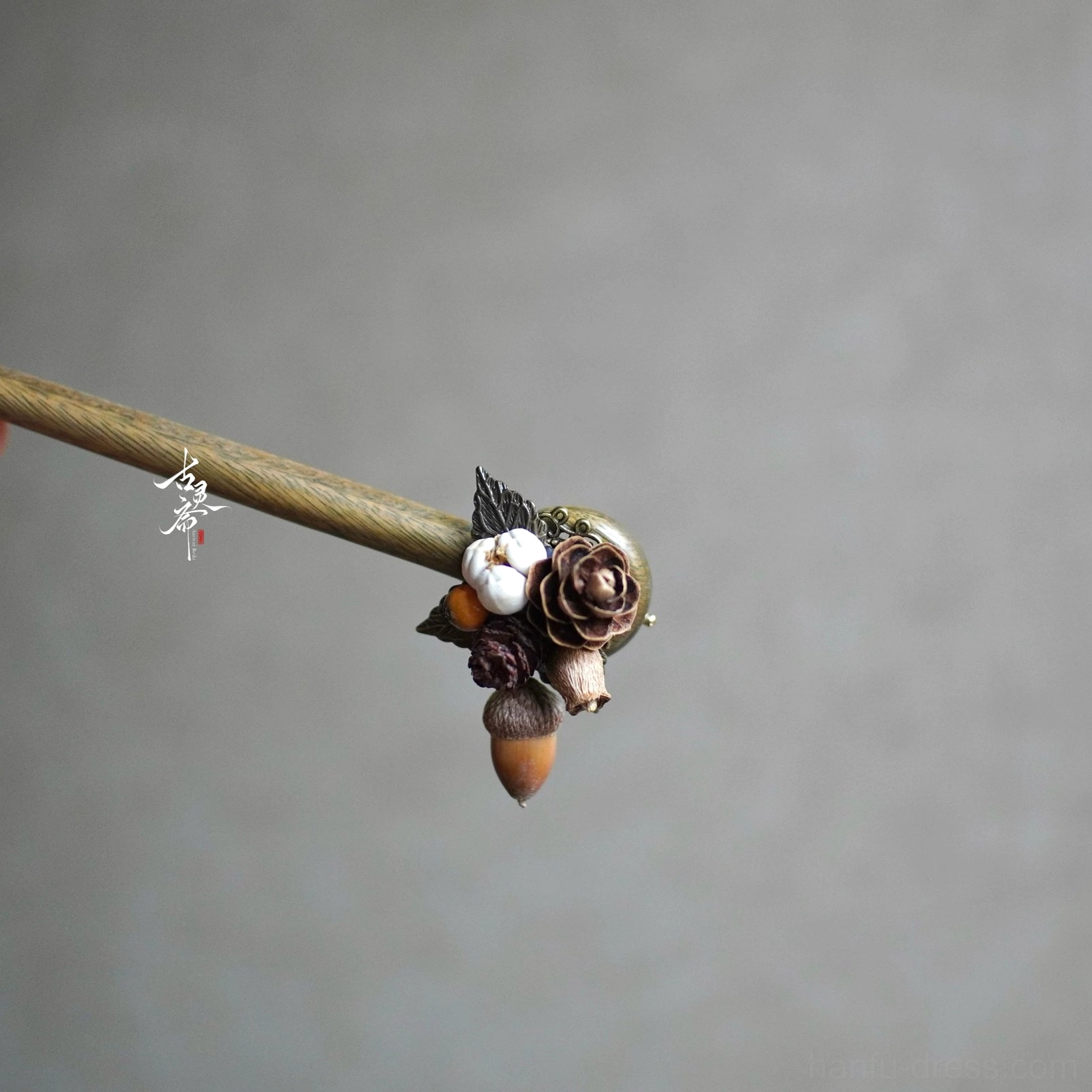 Autumn forest pine wood Chinese hair stick with dried rose cotton pine cone and acorn charm on gray background