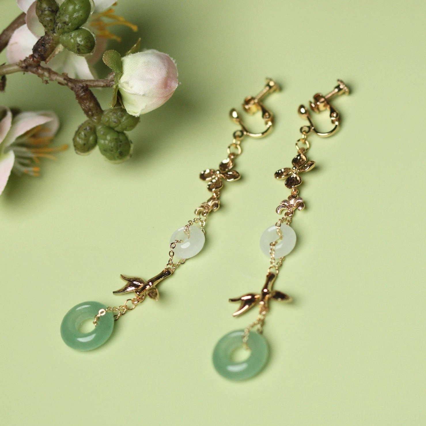 Aventurine green ring Chinese comfort clip-on earrings with gold floral links bamboo charms white jade-tone circles and green pendants