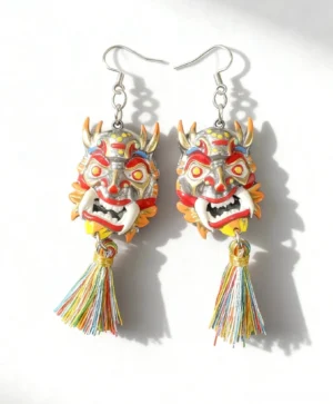 Pair of azure lion mask tassel earrings with silver hook closures, colorful traditional Chinese guardian mask charms, and multicolor tassel pendants on white background