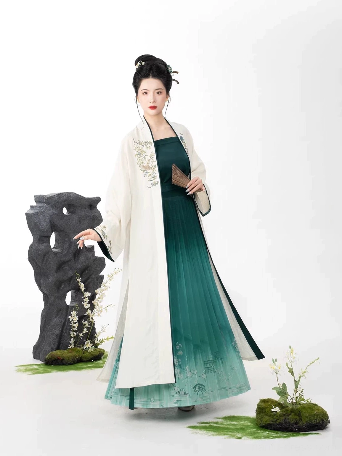 Rear side view of Bamboo Boat Song Dynasty Hanfu with long ivory cardigan drape and embroidered landscape skirt hem