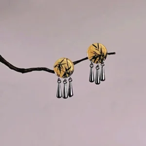 Bamboo Chinese dangle earrings for Cheongsam featuring round yellow wood-toned charms with black ink bamboo artwork and three silver teardrop pendants