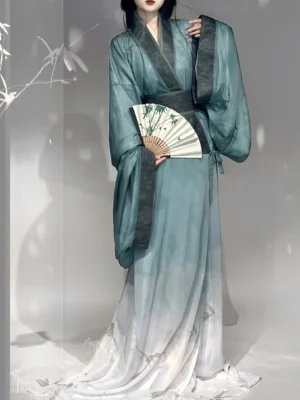 Side view of cyan and white gradient Warring States inspired Hanfu straight hem robe with tied waist sash and folding fan