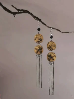 Side view of Chinese Hanfu bamboo leaf tassel earrings showing layered round pendants, silver hook ear wires, and long black beaded tassel movement