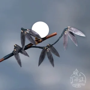 Bamboo moon Chinese hair stick shown in a flat close-up view with dark brown wooden shaft, deep purple bamboo leaves, gold-tone fittings, and round white moon ornament
