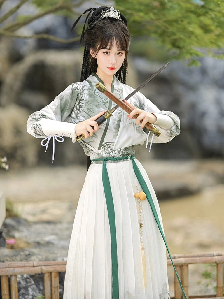 Bamboo print qiyao ruqun Hanfu swordsman outfit front view with cross-collar top green waist sash and lace-up bracers
