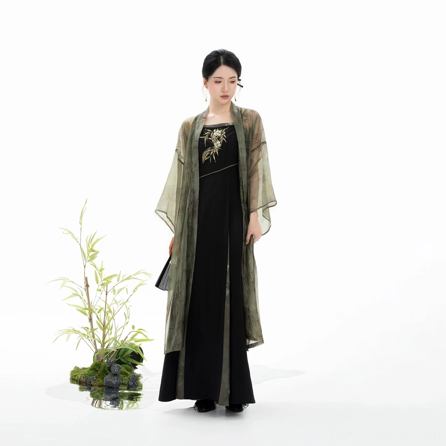 Side view of Bamboo Shadow sheer olive Changgan Temple beizi jacket layered over a slim black Song style slip dress