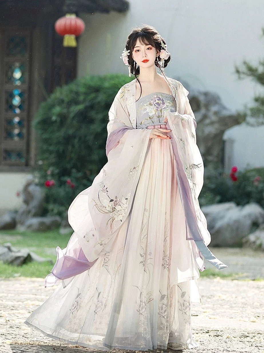Front view of pastel gradient Tang Dynasty Heziqun Hanfu dress with embroidered bodice and sheer outer robe in lantern courtyard