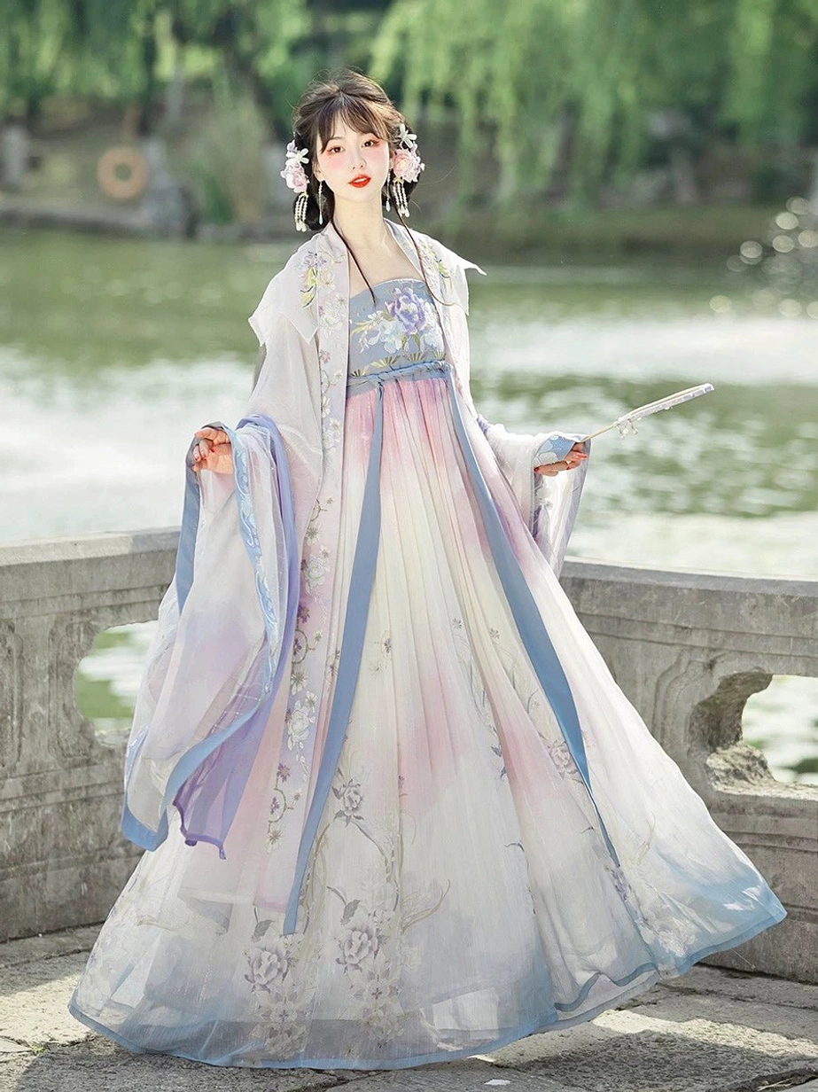 Tang Dynasty style Heziqun Hanfu complete set worn with floral hair ornaments and folding fan on a stone bridge