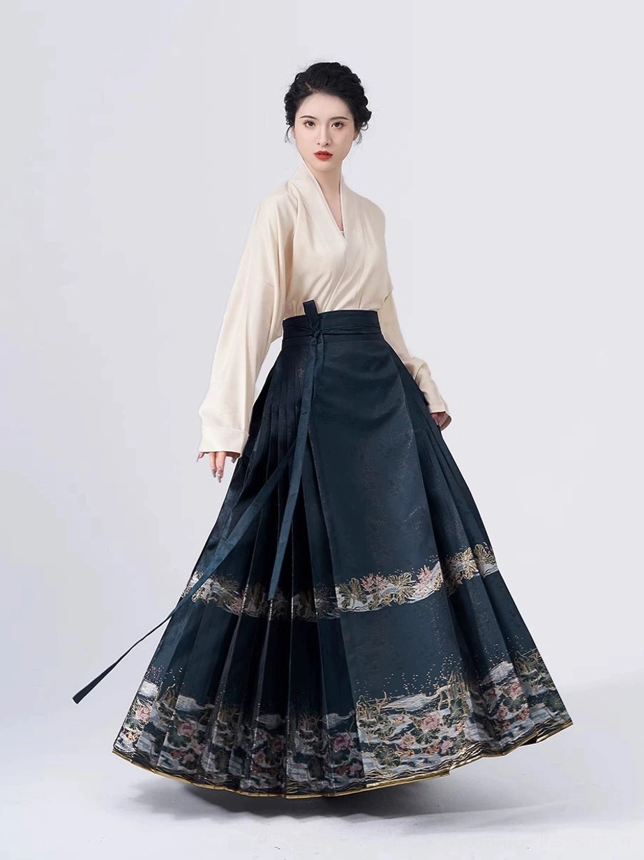 Beige cross-collar Hanfu blouse with dark teal lotus landscape embroidered mamian skirt and golden hem trim