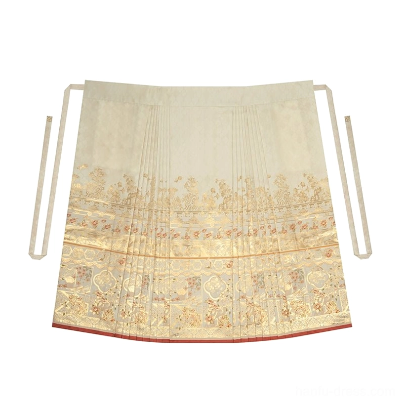 Flat lay of a light beige jacquard mamian skirt with woven gold motifs red hem trim and waist ties