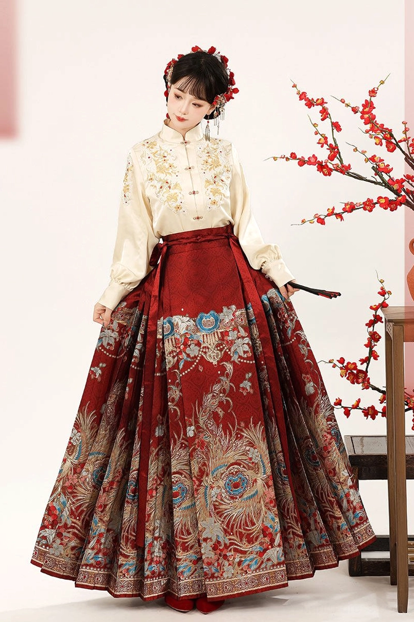 Beige lantern sleeve Ming Dynasty Hanfu top and full-length red patterned mamian skirt in Chinese New Year styling