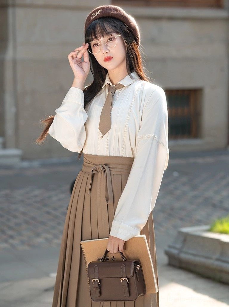 Ming Dynasty inspired beige cotton Tencel Hanfu shirt showing front pintuck details wide sleeves and standing collar