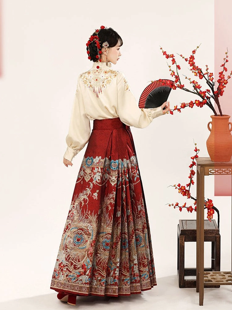 Back view of beige Ming-style Hanfu blouse with embroidered shoulders and red peacock patterned mamian skirt