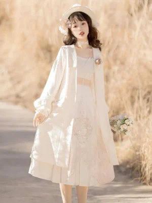 Full front view of cream beige modern Tang-inspired Hanfu dress set with long cardigan, floral embroidered skirt, puff sleeves, and waist belt