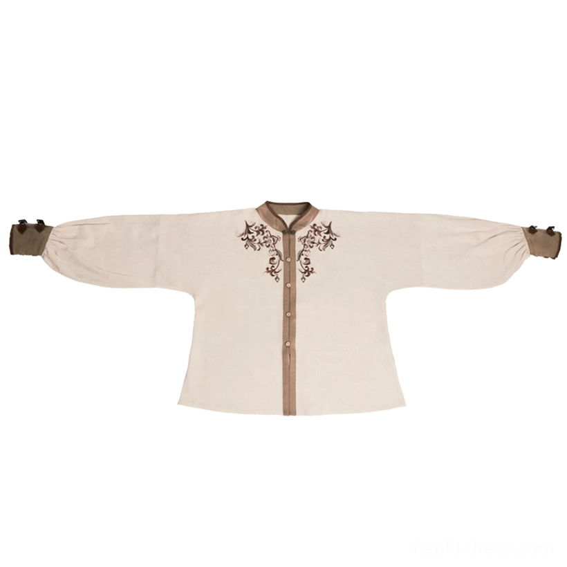 Flat lay display of a beige Tang Dynasty Hanfu long-sleeve top with stand-up collar floral collar embroidery and brown contrast cuff and placket trims