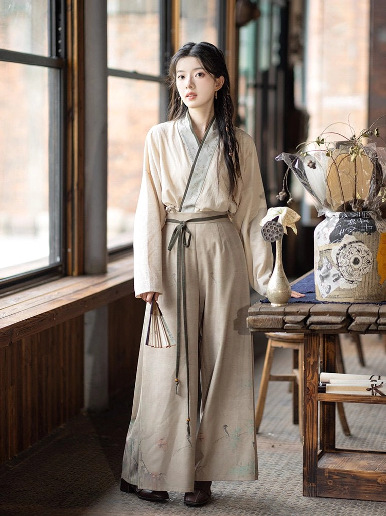 Beige winged sleeve Hanfu top and high-waisted crane botanical print wide-leg pants outfit detail