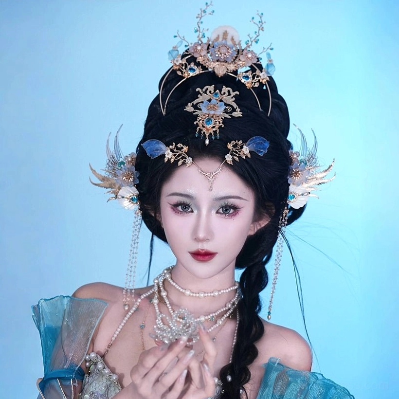 Front styling view of Bihai Ballad blue and gold Hanfu crown set with side hairpins, forehead pearl chain, and layered pearl necklaces