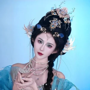 Bihai Ballad blue ocean Hanfu hair accessory set worn with blue traditional Chinese Hanfu, featuring a gold-tone crown, blue glass ornaments, pearl details, and shell flowers