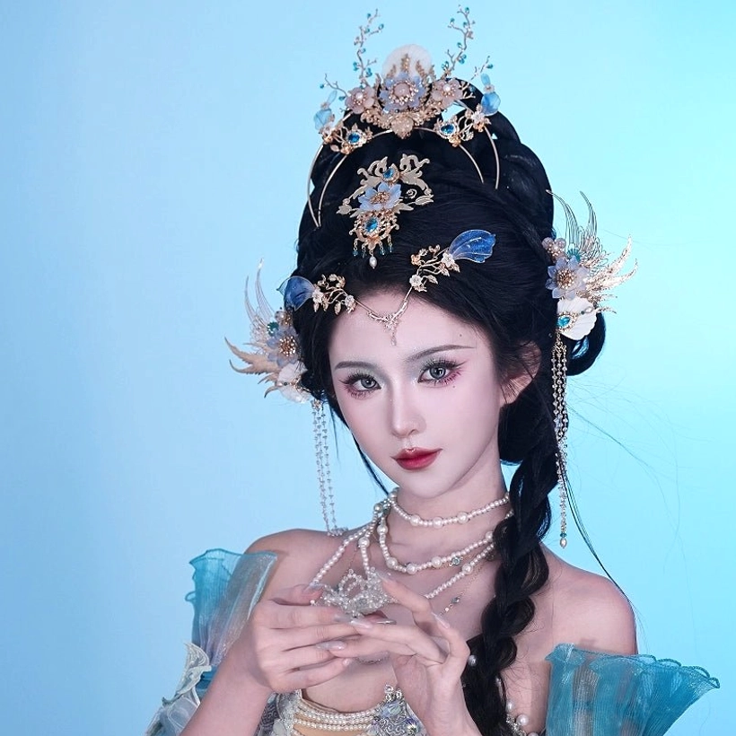 Bihai Ballad complete Chinese Hanfu hair ornament set showing wing-shaped side hairpin, layered blue crown, and pearl forehead chain