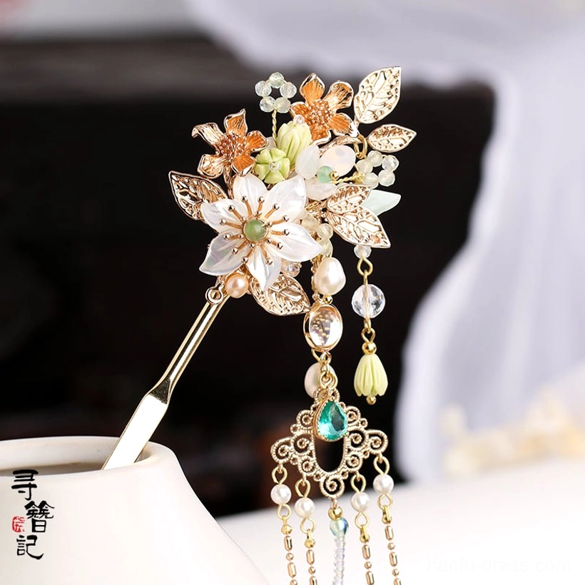 Vintage Chinese Biluo flower hairpin with layered gold toned filigree white blossoms green gemstone style accents pearl-like tassels and chains