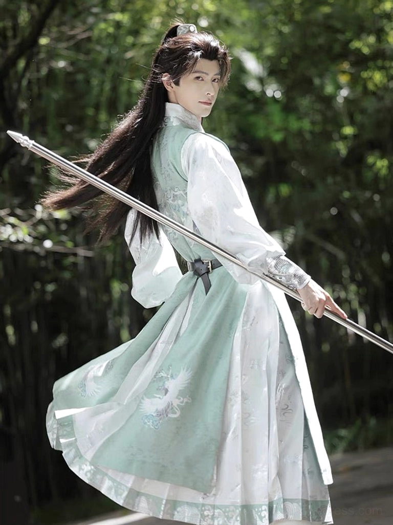 Back three-quarter view of flowing Bixiao Ming Dynasty wuxia hanfu for men with long jade green robe in bamboo forest