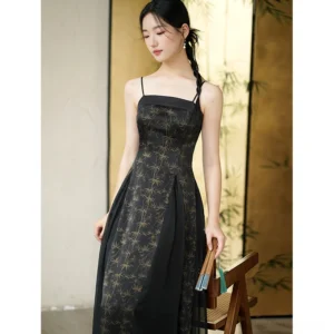 Front view of black bamboo print modern Hanfu slip dress with square spaghetti strap neckline, fitted waist, and flowing floor-length skirt