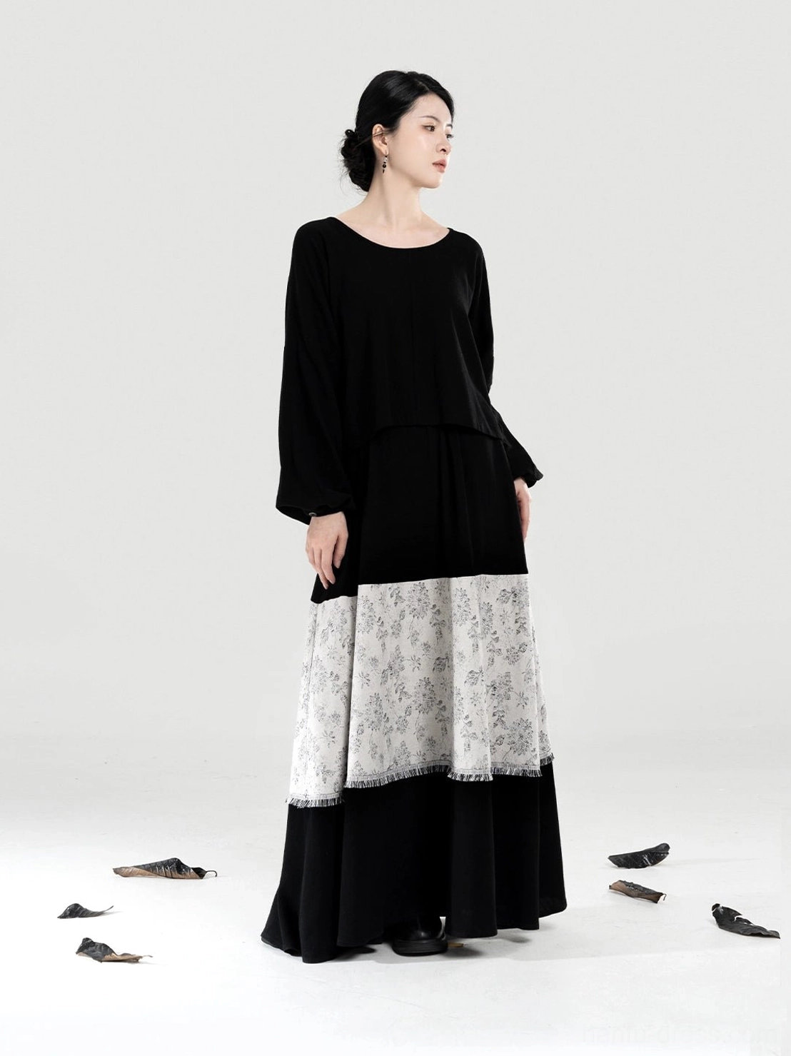 Black bow sleeve top and high waisted three-tone layered A-line skirt from modern Hanfu outfit side view