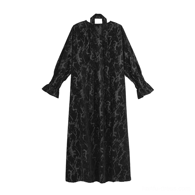 Flat lay of a black chenille jacquard modern Hanfu loose maxi dress with full-length cracked texture, V-neck halter sash, and flared long sleeves