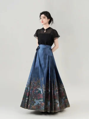 Front view of a fitted black Chinese-style blouse paired with a navy pleated mamian skirt in a minimalist studio