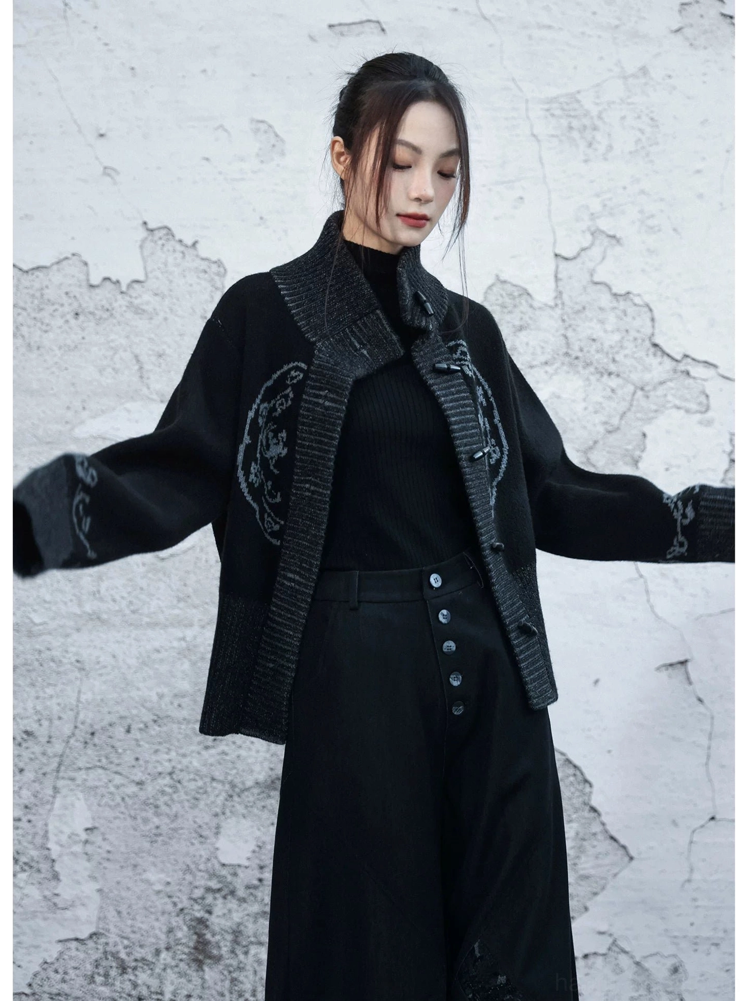 Black Chinese style knit cardigan with grey shawl collar, decorative frog buttons and traditional inspired chest pattern
