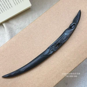 Matte black Chinese hair stick with carved crane and traditional cloud motifs displayed on a kraft paper box for Hanfu and qipao hairstyles