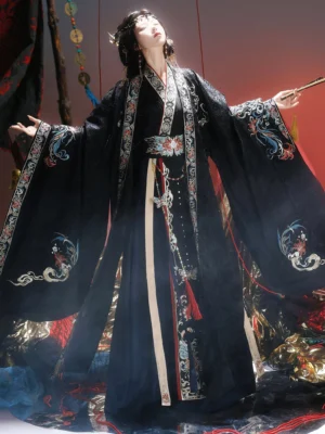 Black embroidered Wei Jin Dynasty Hanfu qiyao ruqun three quarter view showing wide sleeves waist seal and layered skirt