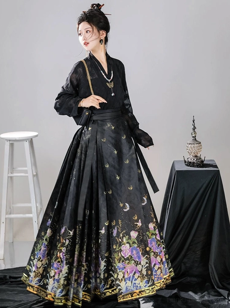 Black Ming Dynasty inspired mamianqun horse face skirt with purple floral hem and subtle celestial print, three-quarter Hanfu outfit view