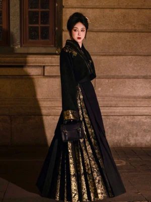 Full-body side view of a woman wearing a black and gold Ming Dynasty modern Hanfu set with embroidered cropped jacket and pleated Mamian skirt on a vintage stone street at night